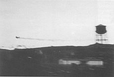 The Zero trailing oil over Dutch Harbor, moments after being hit