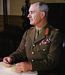Colour portrait photograph of Field Marshal Archibald Wavell in khaki uniform jacket with red collar-dogs and cloth medal strips