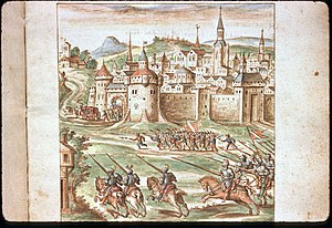 A Cavalry charge as people flee back towards a city