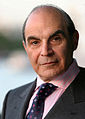 Image 14 David Suchet Photo credit: Phil Chambers A portrait of David Suchet OBE, an English actor best known for his television portrayal of Agatha Christie's Hercule Poirot in the television series Agatha Christie's Poirot. For this role, he earned a 1991 British Academy Television Award (BAFTA) nomination. In preparation for the role he says that he read every novel and short story, and compiled an extensive file on Poirot. More selected portraits