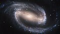 Image 15NGC 1300 is a barred spiral galaxy located roughly 69 million light-years away in the direction of the constellation Eridanus. In its core, the nucleus shows its own extraordinary and distinct "grand-design" spiral structure that is about 3,300 light-years long.