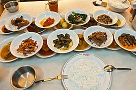 The hidang style Padang food served at Sederhana restaurant; all of the bowls of food are laid out in front of customer. The customer only pays for whatever bowl they eat from.