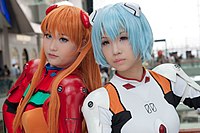Two cosplayers portraying character from the Neon Genesis Evangelion franchise - an iconic Japanese TV series from the mid '90s that has had a significant impact on Japanese popular culture, sparking a rebirth of the anime industry, revitalizing the mecha genre, and making cosplay a worldwide phenomenon.