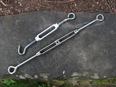 Top: lower quality aluminum bolt and hook turnbuckle; bottom: higher quality cast stainless steel turnbuckle