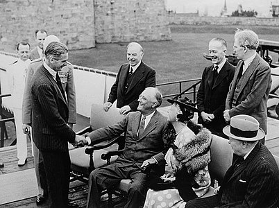 President Roosevelt, seated next to Princess Alice and Prime Minister King of Canada, greeting British Foreign Secretary Anthony Eden.
