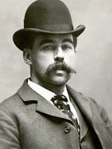 A portrait of Holmes from somewhere between the 1880s and early 1890s, facing right and looking in the camera's direction.