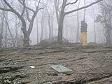 A hiker signs the Appalachian Trail register at Springer Mountain