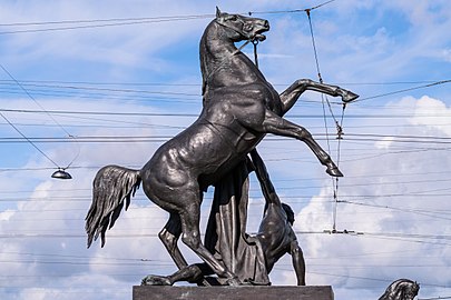 The Horse Tamers, on the Anichkov Bridge, designed by the Russian sculptor, Baron Peter Klodt von Jurgensburg. The silhouettes of the sculptural groups on high pedestals are so expressive that they ensured incredible success for this monument. (photo)