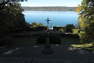 View through the park to the lake where a cross marks the spot in the shallow water where Ludwig II's body was found on 13 June 1886.