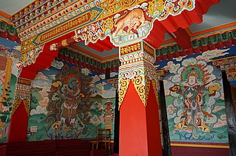Thankas painted on the walls of Drepung