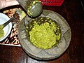 Freshly made green curry paste in a mortar