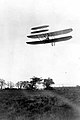 The Wright Flyer III, now in Carillon Historical Park, shown being flown by Orville Wright on October 4, 1905, over Huffman Prairie near Dayton