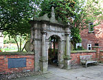 Forecourt wall and gateway of Wright's Almshouses, Beam Street