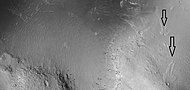 Close view of craters that just have ejecta on one side. Image acquired by HiRISE under HiWish program.