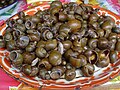 A dish of cooked freshwater snails, ampullariids and viviparids from Poipet, Cambodia