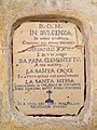 Terracotta plaque walled into the façade of the church of Santa Caterina