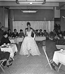 Hepburn participating in a charity fashion show for Givenchy in 1956