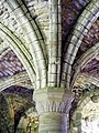 A capital of one of the four columns supporting the rib vaulted roof of the chapter house.