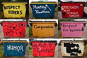 Colorful dumpsters painted with slogans