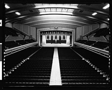 Interior view looking to stage and concert hall beyond, c. 1930