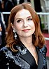Isabelle Huppert at the 2018 Cannes Film Festival looking to the left and smiling
