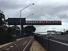 Large metal gantry with LED speed limit signs