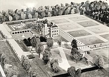 a black-and-white photograph showing a scale model of Ham House surrounded by its formal gardens, which is ringed by miniature trees