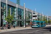 The Portland Streetcar platform at Oregon Convention Center with a streetcar stopped next to it.