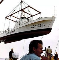 Point Mast being loaded on board a merchant ship for shipment to the Philippines