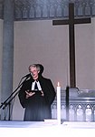 A pastor leads prayer in the Czech Brethren Church of John Amos Comenius for the International AIDS Candlelight Memorial (2001)