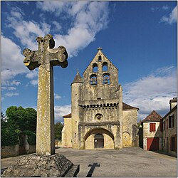 The church and cross in Lamothe-Fénelon