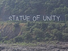 Statue of Unity sign board across the river