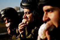 Israeli soldiers enjoying sufganiyot as part of their Hanukkah festivities.