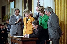 Ronald Reagan with Nancy Reagan, Paula Hawkins, Charles Rangel and Benjamin Gilman for the signing ceremony for the Anti-Drug Abuse Act of 1986 in the East Room, 1986