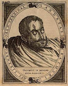 A head of a bearded man with a wound on his forehead
