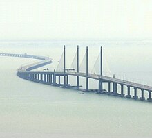 An aerial view of the Second Penang Bridge main span, a dual pylon cable-stayed structure with concrete edge girders and deck slab.