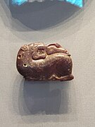 Etruscan amber pendant of a lion and a swan