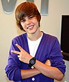 Wings haircuts and cardigan sweaters were popular during the mid-to-late part of the 2000s (and into the early 2010s), modeled here by singer Justin Bieber in 2009.
