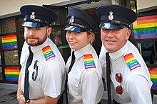 MGS officers displaying pride epaulettes wearing peaked caps