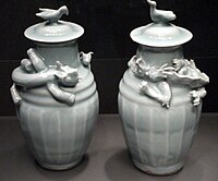 Pair of funerary lidded vases with animals; left, tiger chasing a dog, right, dragon chasing a pearl, Southern Song