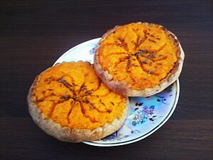 Sklandrausis is a sweet Latvian pie of Livonian origin, made of rye dough and filled with potato and carrot paste and caraway.