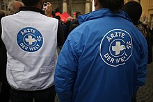 Staff members from the German branch in organization jackets with logo