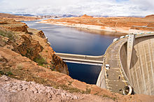 View of Glen Canyon Dam and Lake Powell from the edge of the canyon.