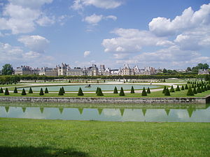 The canal, round basin, parterre and behind, the Chateau