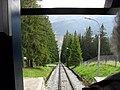 Entering the mountain station with a distant view of the ski-run overbridge
