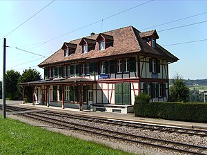 Two-story station building with hip roof