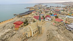 An aerial view of Lüderitz with the Felsenkirche in the foreground and the rest of the town in the background
