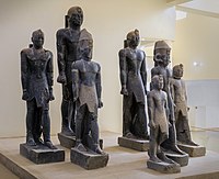 Statues of various rulers of the late 25th Dynasty–early Napatan period: Tantamani, Taharqa (rear), Senkamanisken, again Tantamani (rear), Aspelta, Anlamani, again Senkamanisken. Kerma Museum.[3]