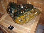 Green-yellow-and-orange polished jasper boulder, Tropical Parc, musée des mineraux, Saint-Jacut-les-Pins, Brittany