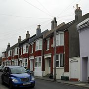 These brick houses on Belton Road occupy the site of a former windmill, whose bricks were reclaimed and used for the houses.